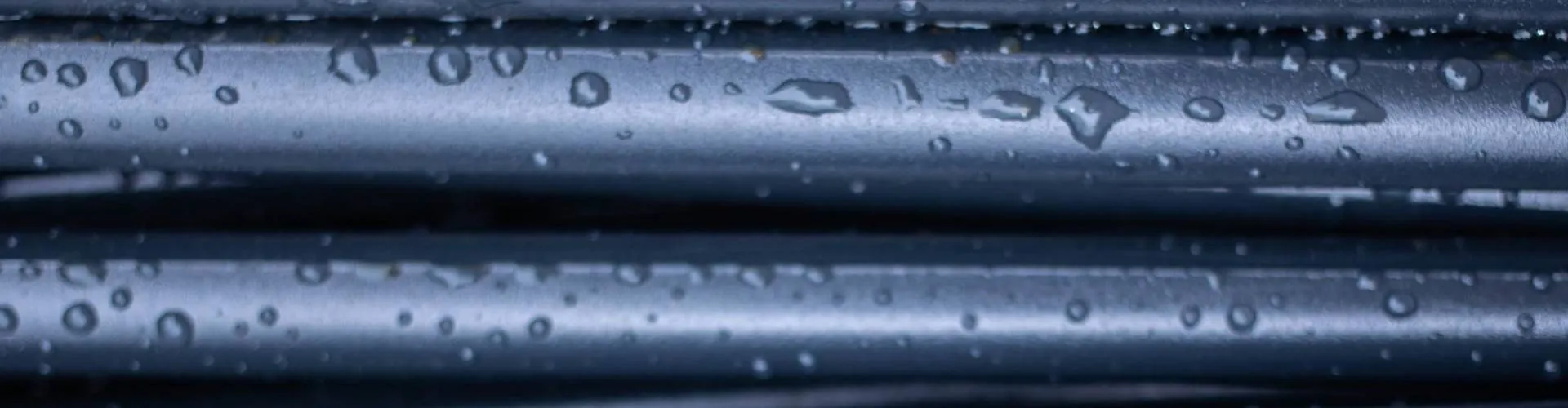 Water beading on dark rubber roofing
