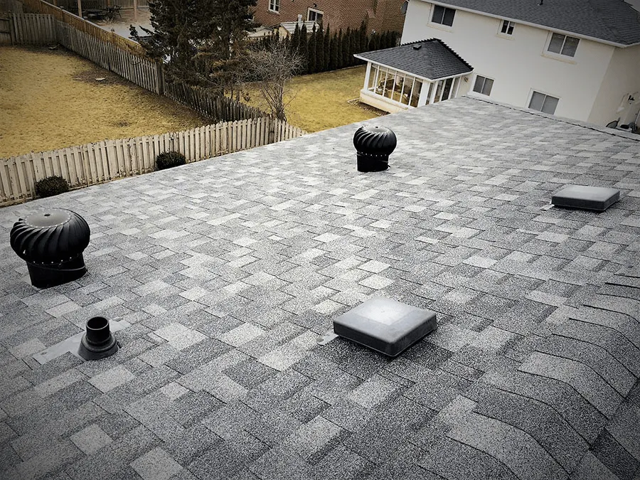 Grey shingle roof with turbine vents and box vents